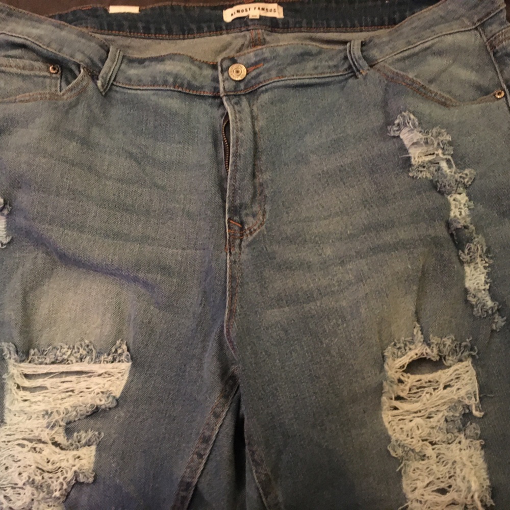 Almost famous distressed jeans size 20 never worn.